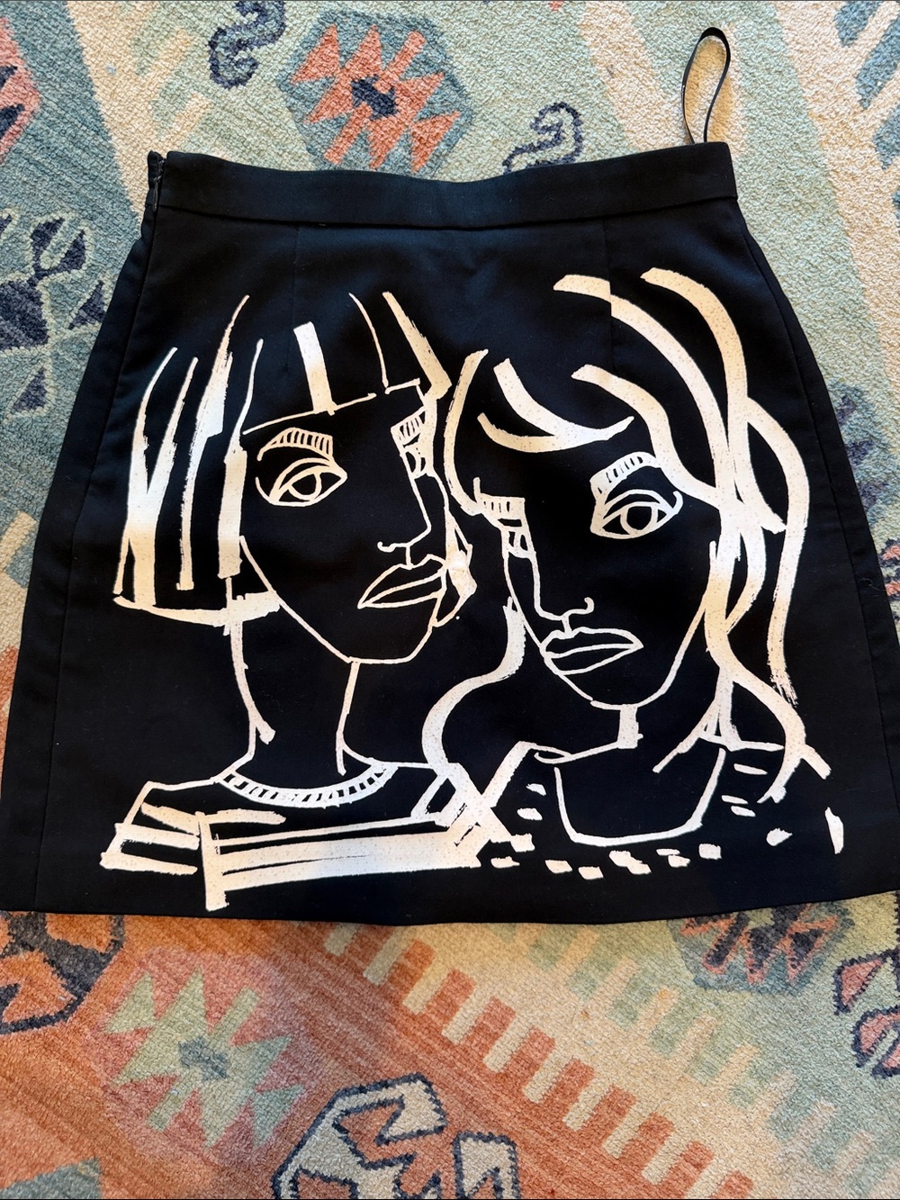 Ochirly Women’s Black Mini Skirt with White Graphic Faces